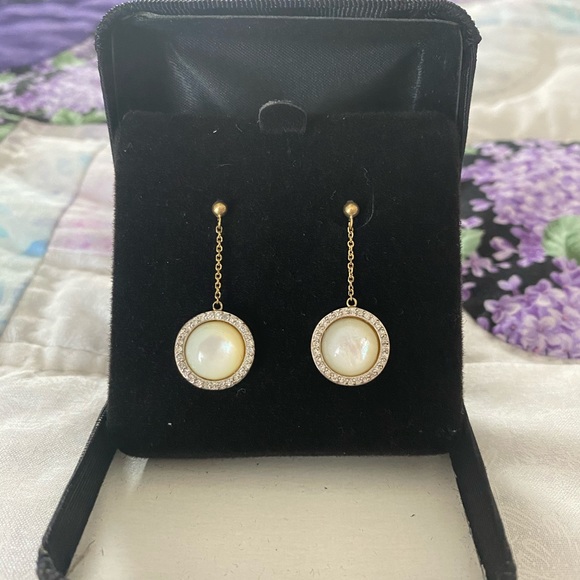 10k mother of pearl and diamond earrings.